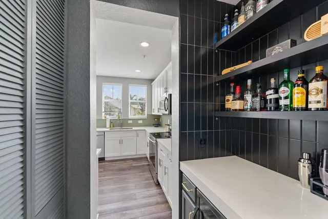 a kitchen with stainless steel appliances a refrigerator and sink