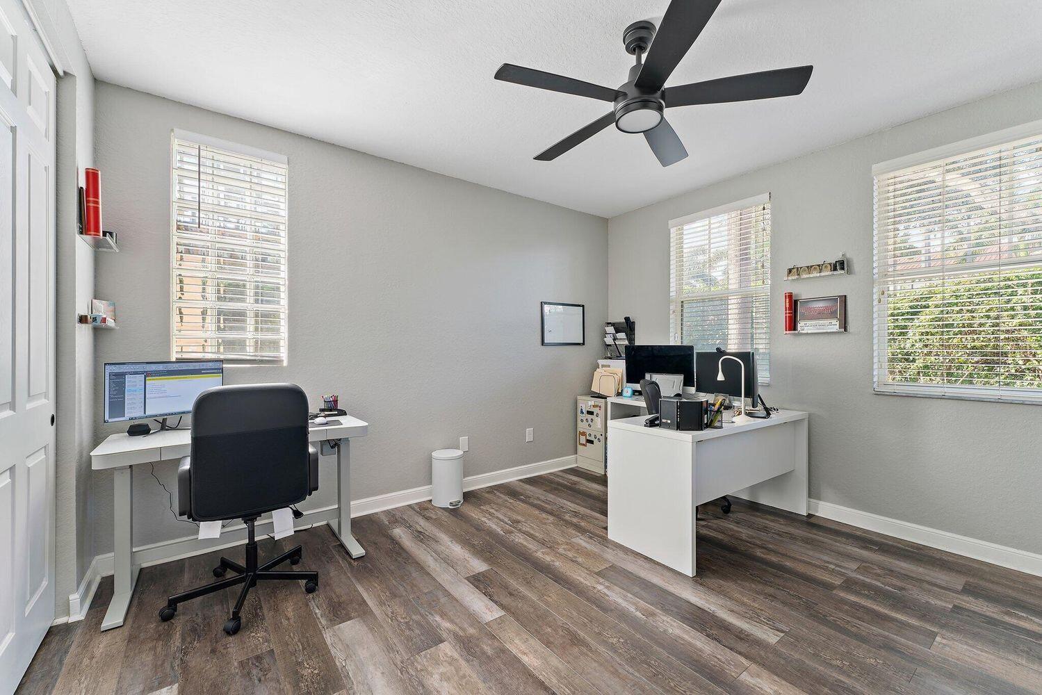 500 Pacific Grove Drive, Unit 8 West Palm Beach, FL 33401 - Photo 4 of 35 a work room with furniture and windows