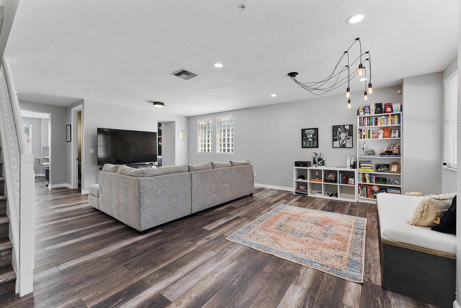 500 Pacific Grove Drive, Unit 8 West Palm Beach, FL 33401 - Photo 6 of 35 a living room with furniture and a flat screen tv
