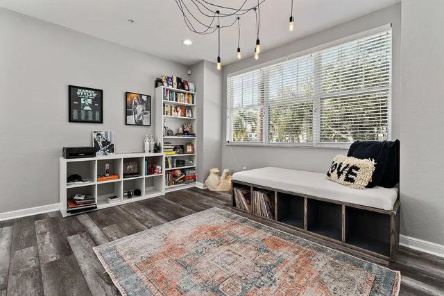 a bed room with a bed and a book shelf