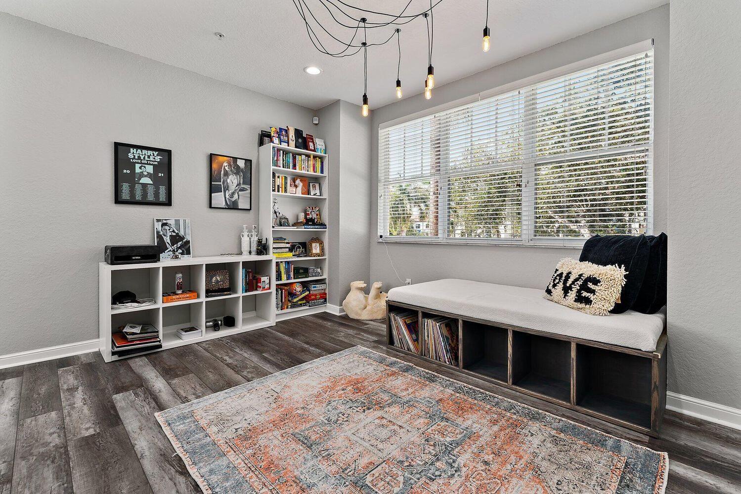 500 Pacific Grove Drive, Unit 8 West Palm Beach, FL 33401 - Photo 7 of 35 a bed room with a bed and a book shelf