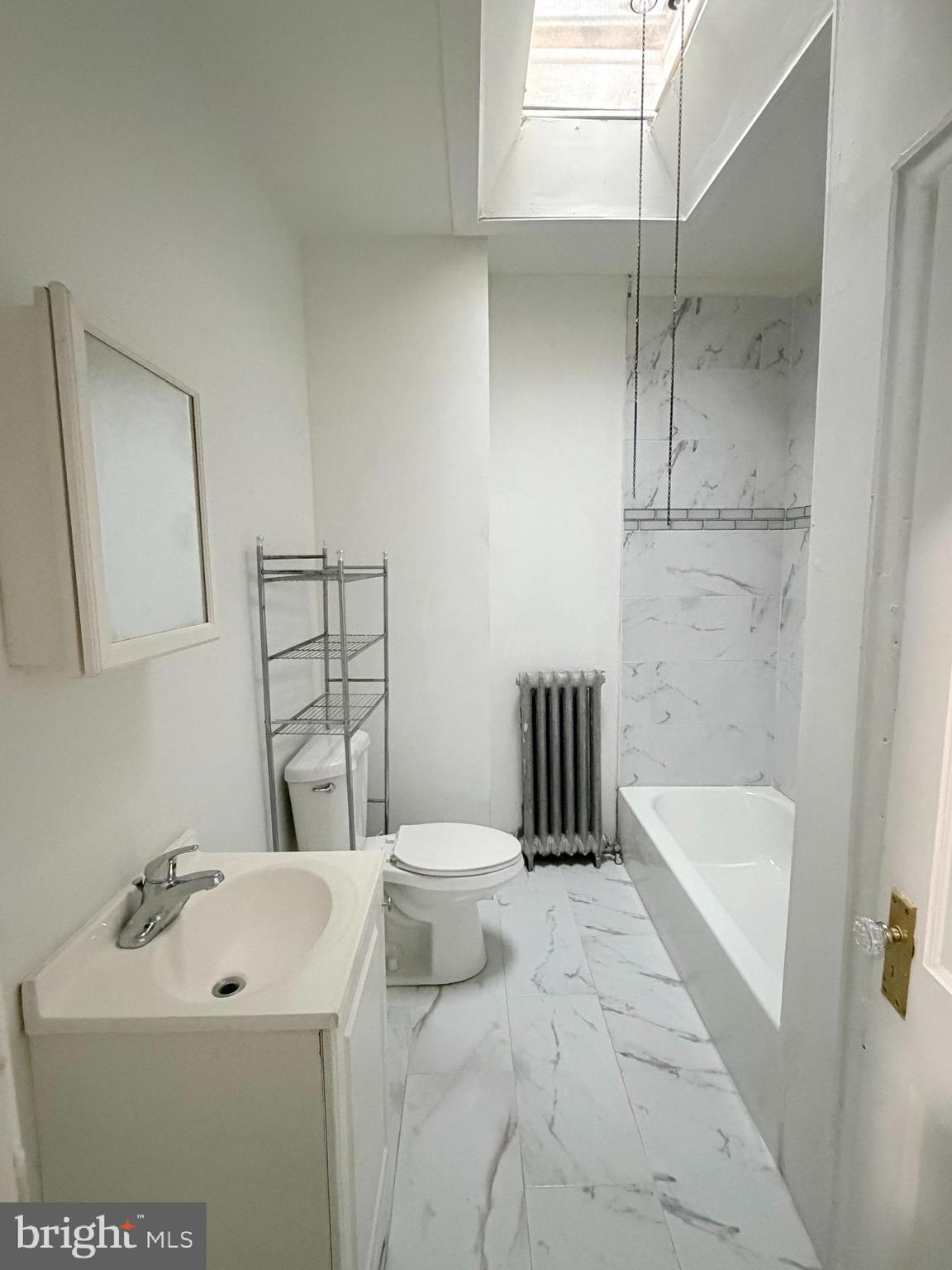 51 North State Road Upper Darby, PA 19082 - Photo 11 of 12 a bathroom with a sink a toilet and shower