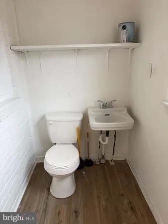 a bathroom with a toilet and a sink