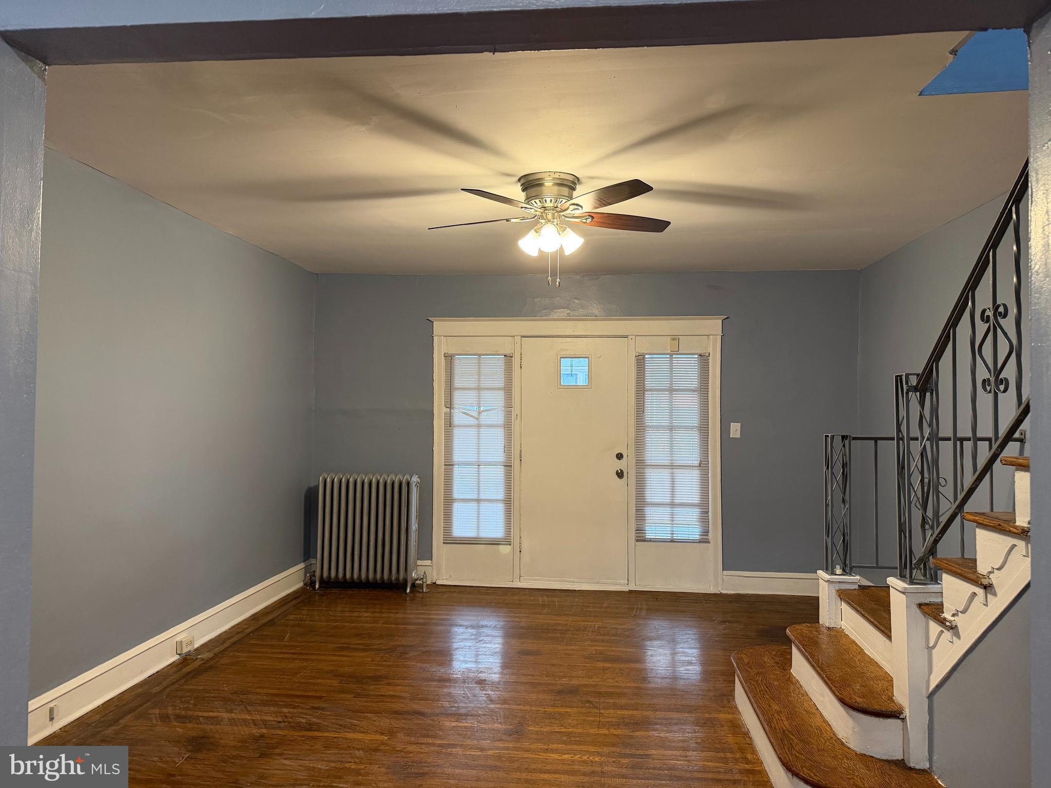 51 North State Road Upper Darby, PA 19082 - Photo 2 of 12 a view of an empty room with wooden floor and a ceiling fan