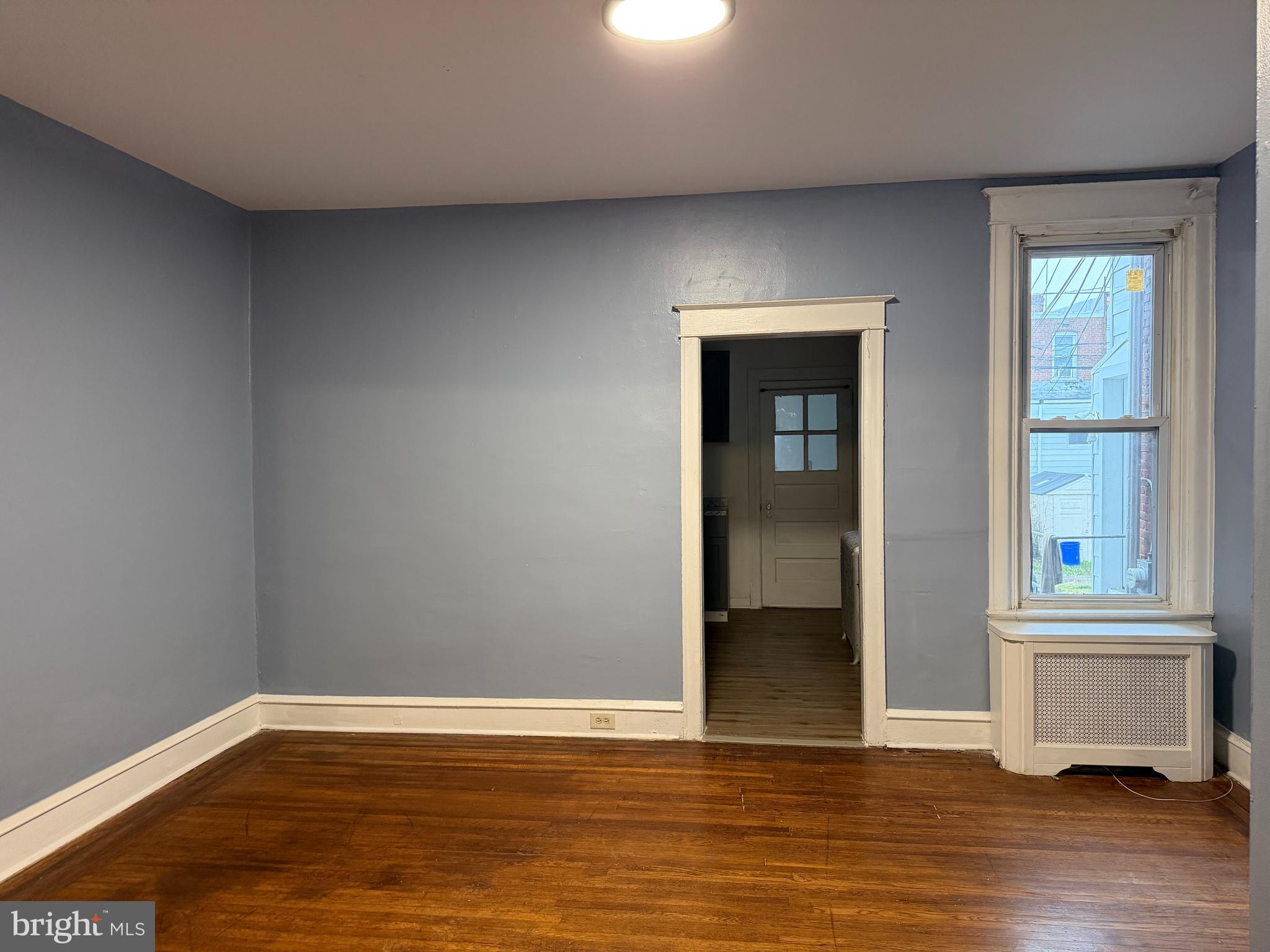 51 North State Road Upper Darby, PA 19082 - Photo 4 of 12 an empty room with wooden floor and windows