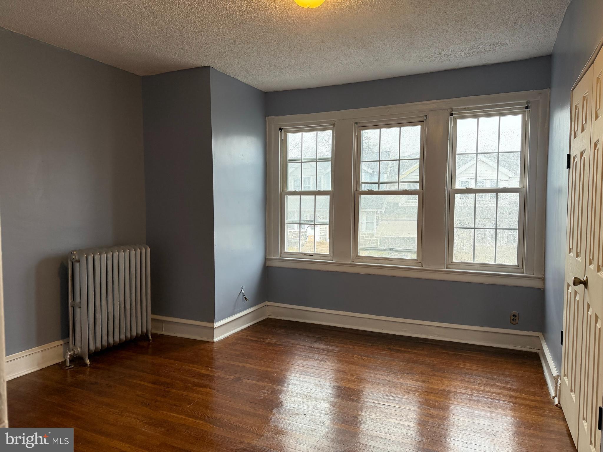51 North State Road Upper Darby, PA 19082 - Photo 6 of 12 wooden floor in an empty room with a window