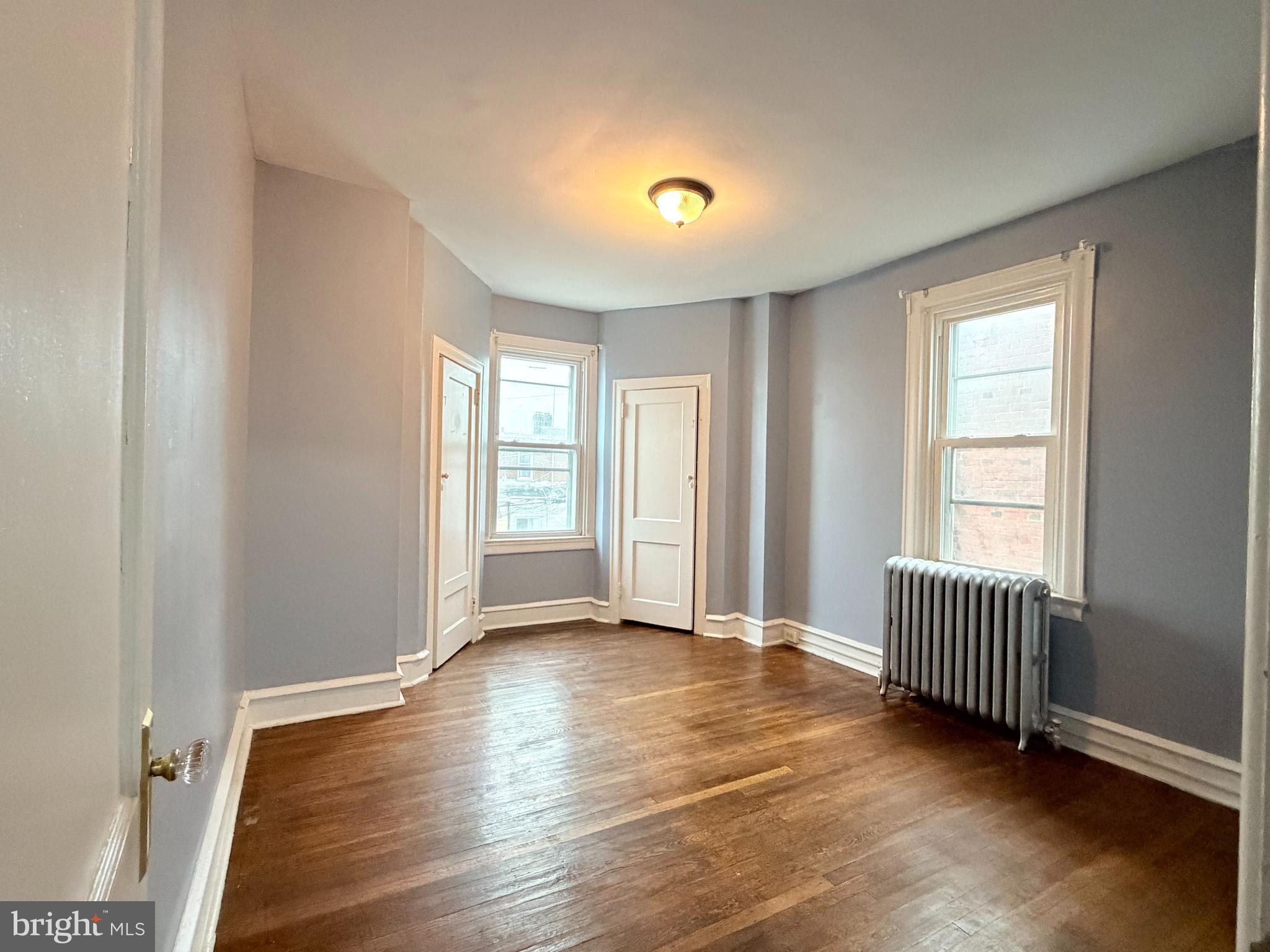 51 North State Road Upper Darby, PA 19082 - Photo 9 of 12 an empty room with wooden floor and windows