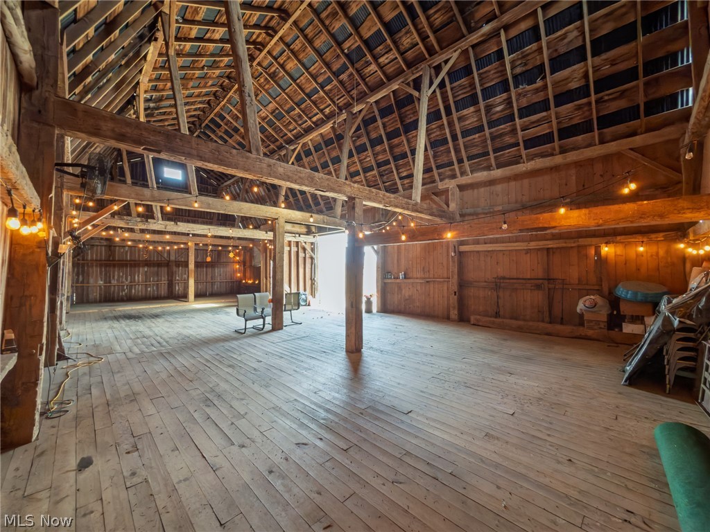 14178 West Road Wakeman, OH 44889 - Photo 11 of 35 Misc room with lofted ceiling and light wood-style floors