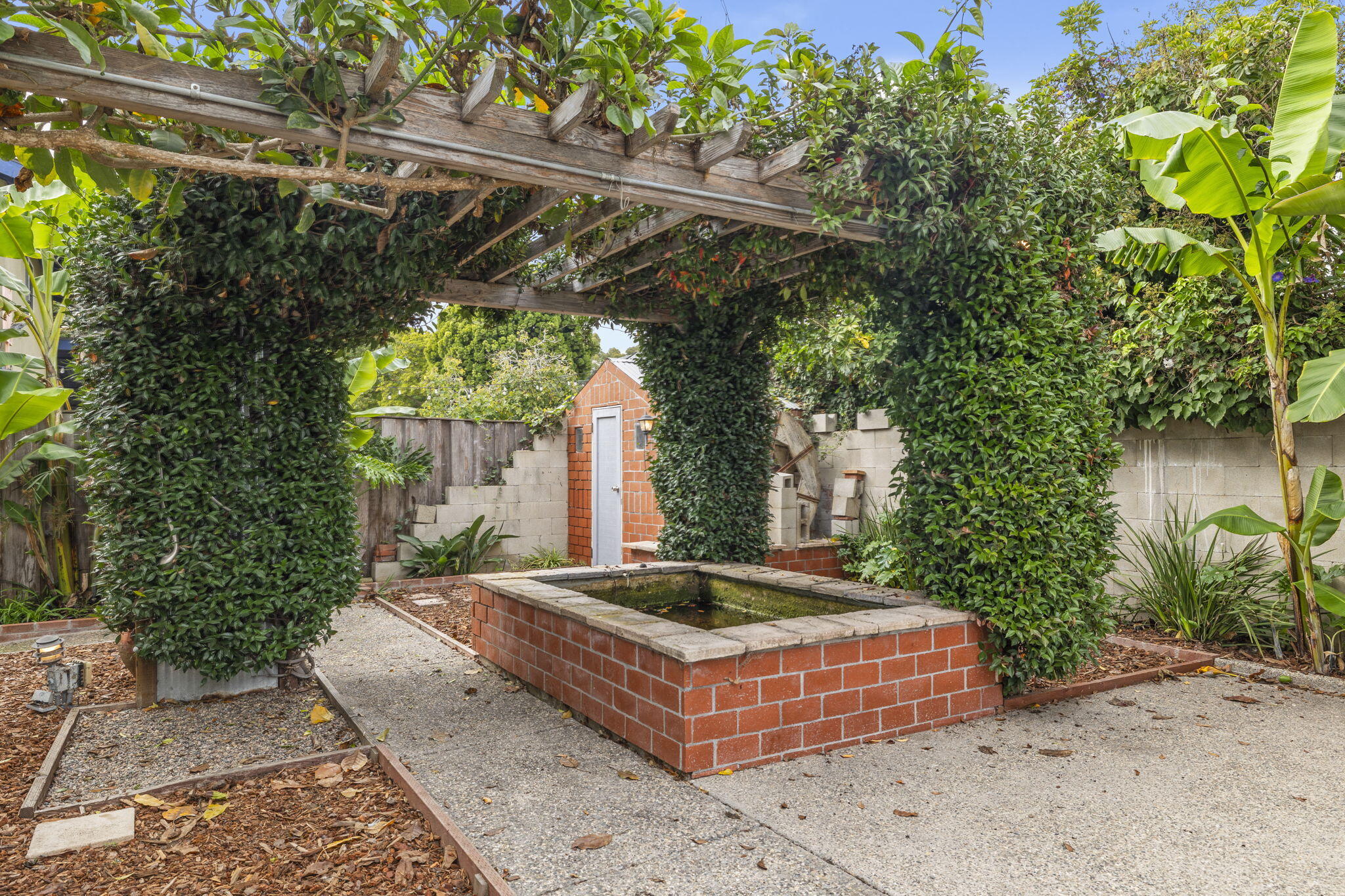 6870 Trigo Road Goleta, CA 93117 - Photo 19 of 25 a front view of a house with garden