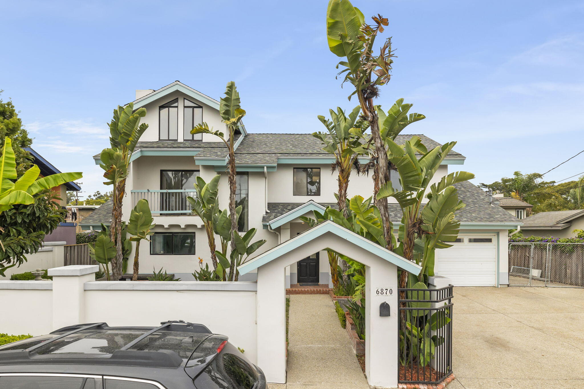 6870 Trigo Road Goleta, CA 93117 - Photo 2 of 25 a front view of a house with a yard