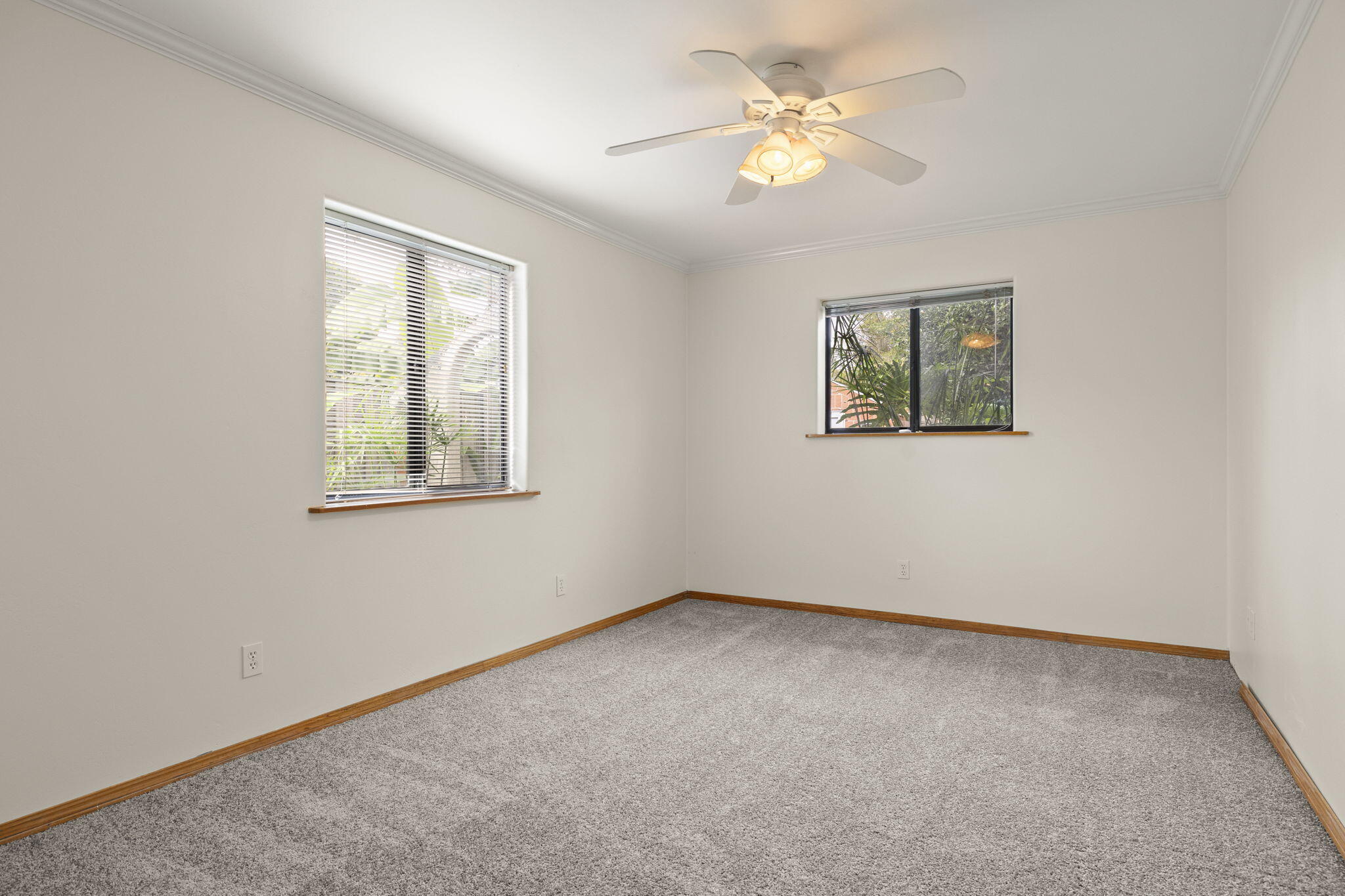 6870 Trigo Road Goleta, CA 93117 - Photo 9 of 25 an empty room with windows and fan