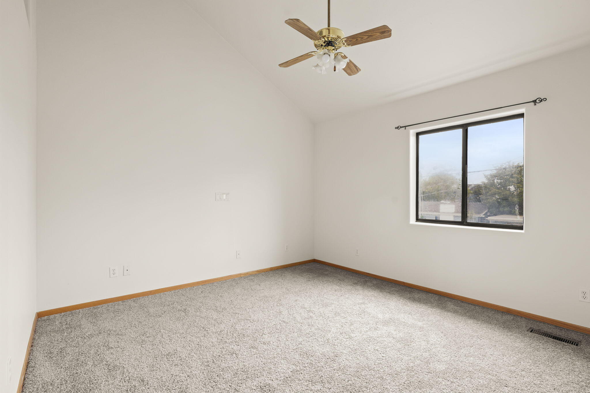 6870 Trigo Road Goleta, CA 93117 - Photo 10 of 25 an empty room with a window and a ceiling fan