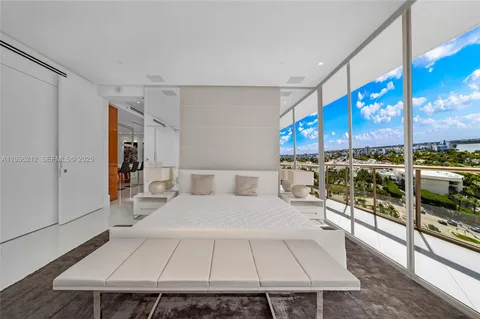 a spacious bathroom with a double vanity sink and a large mirror