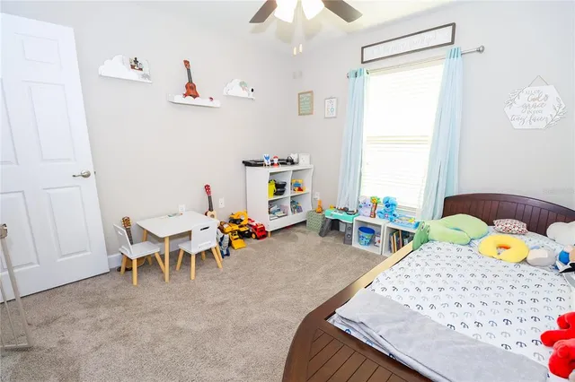 a bedroom with furniture and a window