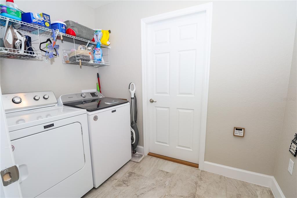 10396 Southwest 45th Avenue Ocala, FL 34476 - Photo 10 of 18 a utility room with dryer and washer