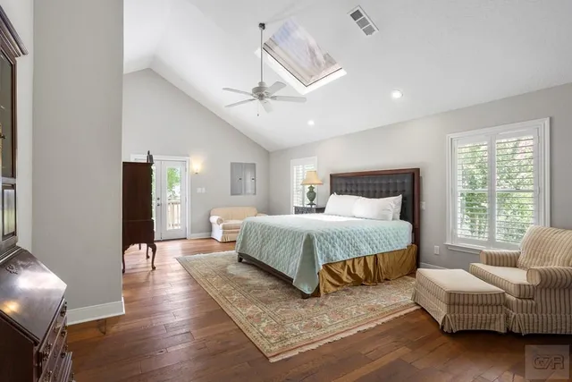 a bed room with a bed window and a television