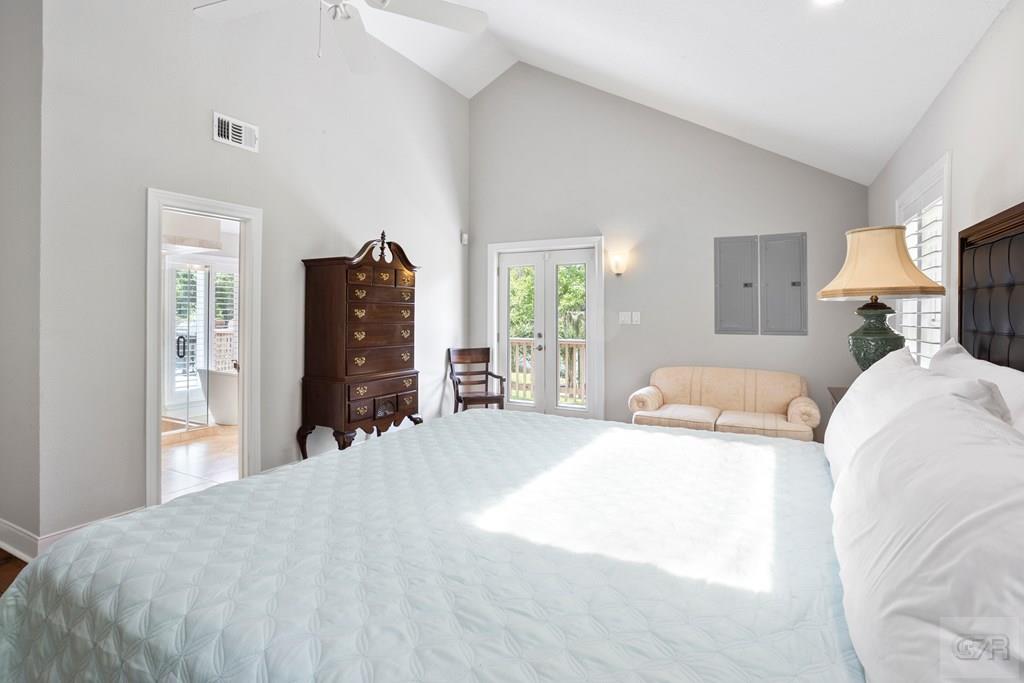 14009 West Hughes Road Dickinson, TX 77539 - Photo 15 of 54 a bed room with a bed window and a television