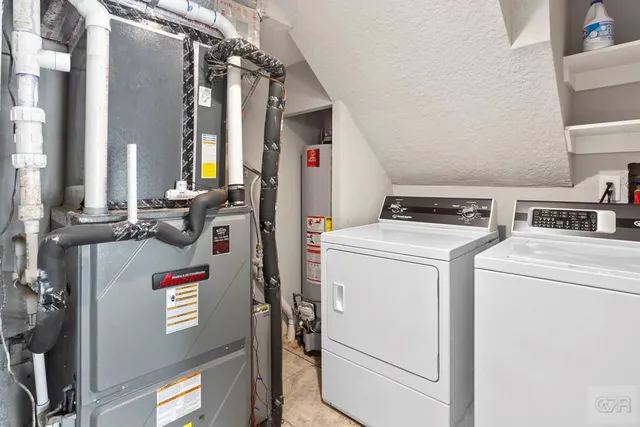 a living room with furniture and a clock