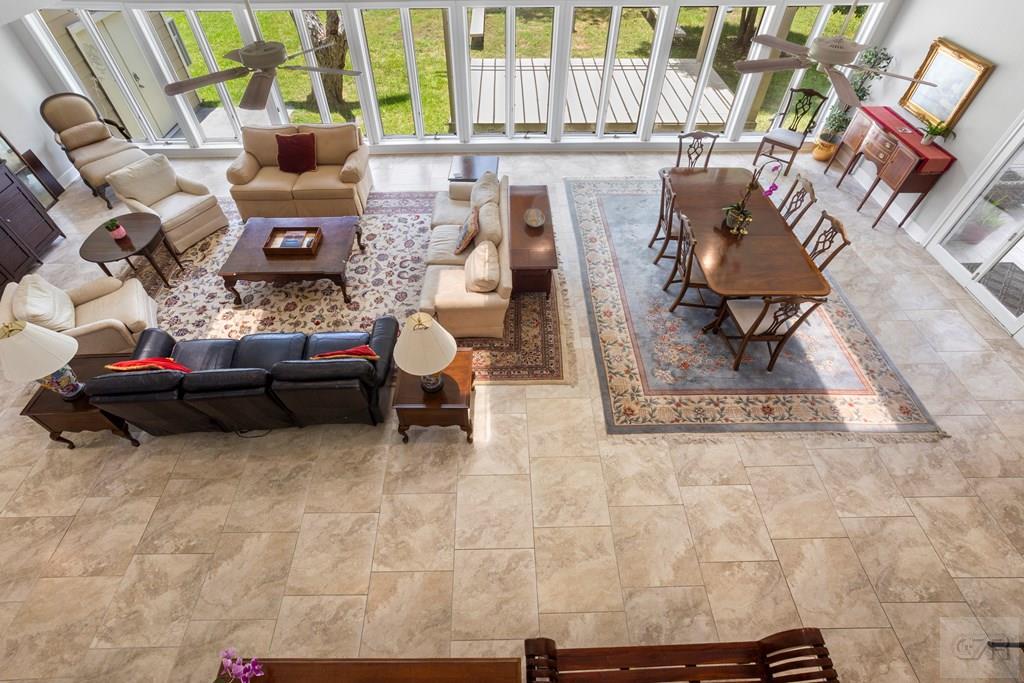 14009 West Hughes Road Dickinson, TX 77539 - Photo 23 of 54 a living room with furniture and a clock
