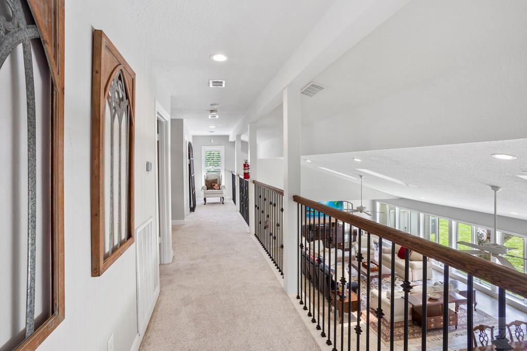 14009 West Hughes Road Dickinson, TX 77539 - Photo 24 of 54 a view of a hallway with wooden floor and stairs