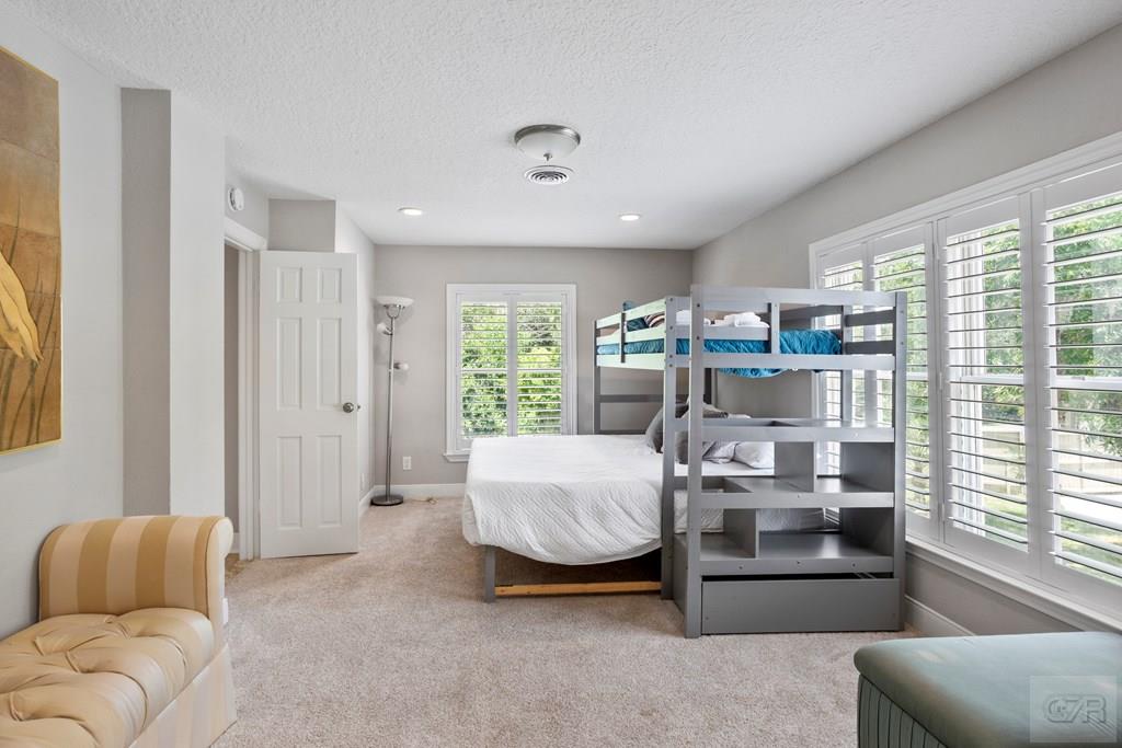 14009 West Hughes Road Dickinson, TX 77539 - Photo 27 of 54 a living room with furniture and a large window