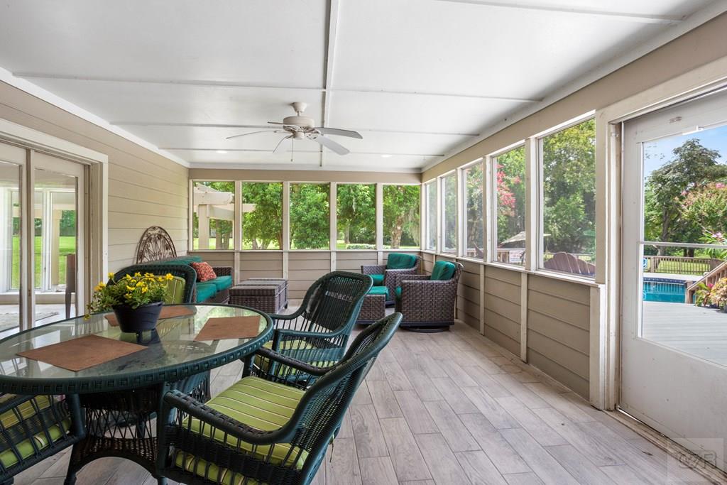 14009 West Hughes Road Dickinson, TX 77539 - Photo 31 of 54 a living room with furniture a table and chairs