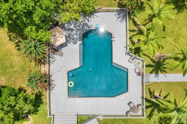 a view of yard with swimming pool