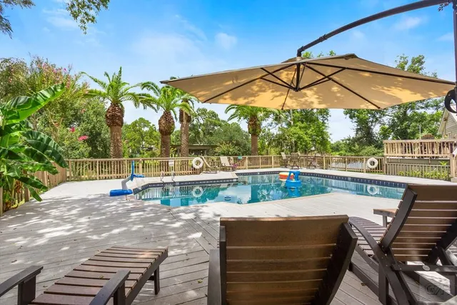 a view of a house with swimming pool