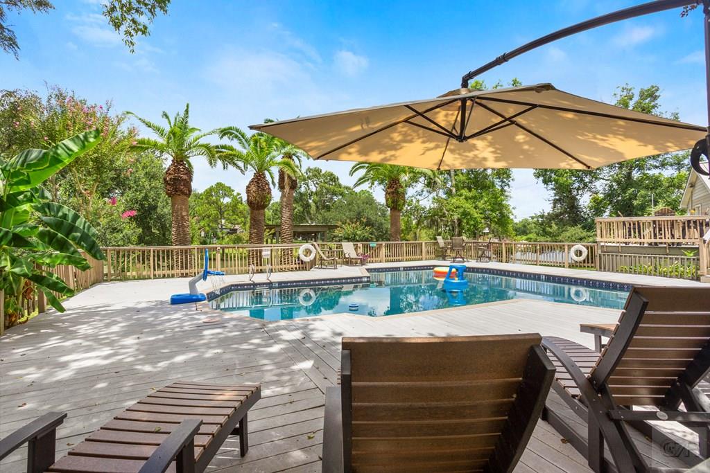 14009 West Hughes Road Dickinson, TX 77539 - Photo 37 of 54 a view of a yard with a patio