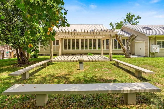 a view of a house with a backyard