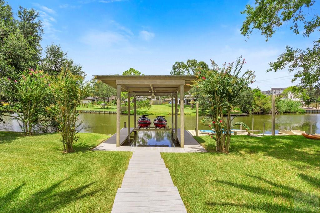 14009 West Hughes Road Dickinson, TX 77539 - Photo 39 of 54 a view of a house with a backyard