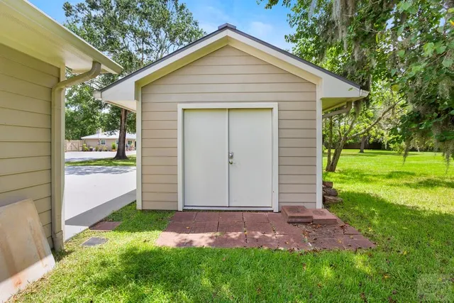 a view of a park with large trees