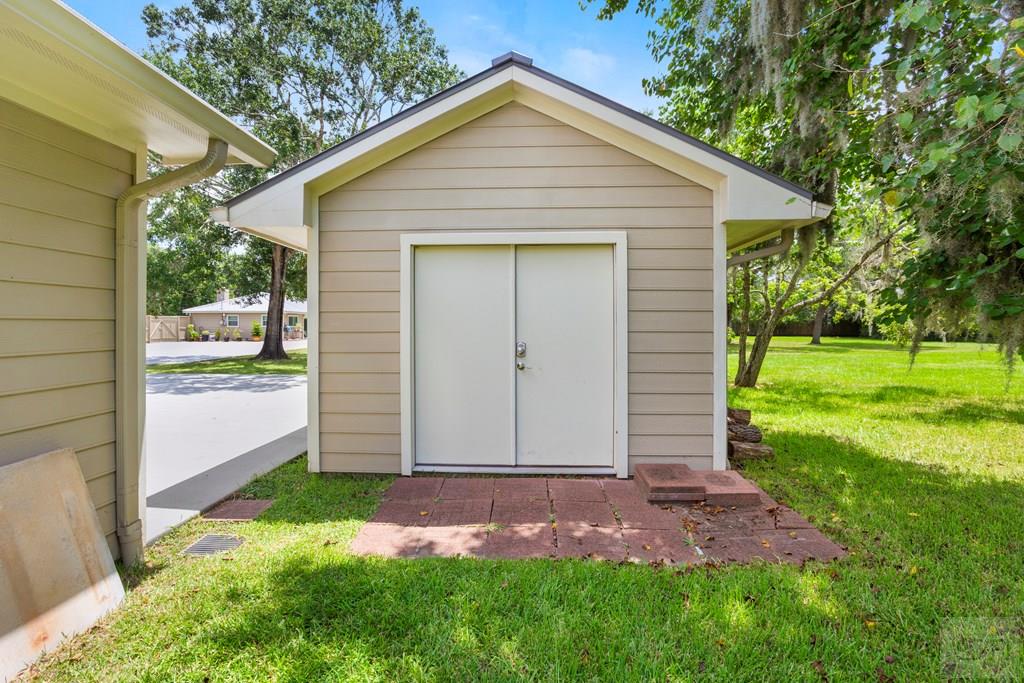 14009 West Hughes Road Dickinson, TX 77539 - Photo 42 of 54 a front view of house with yard