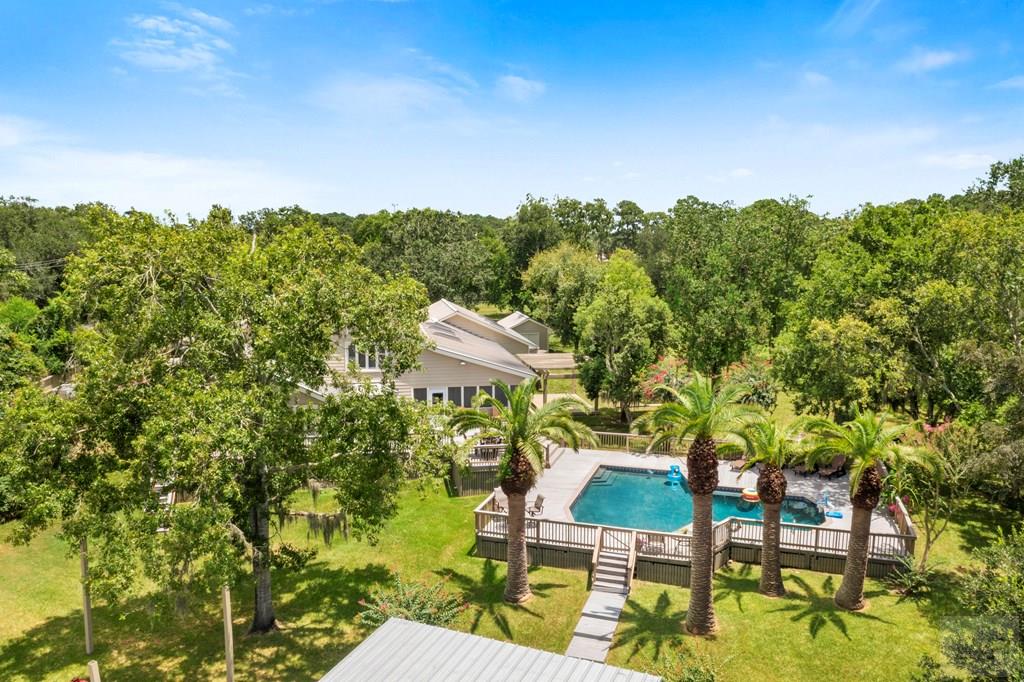 14009 West Hughes Road Dickinson, TX 77539 - Photo 50 of 54 a view of a chairs and table in a backyard