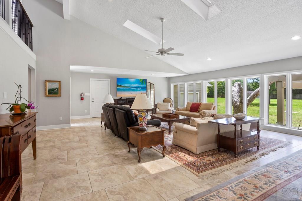 14009 West Hughes Road Dickinson, TX 77539 - Photo 6 of 54 a living room with furniture and a large window