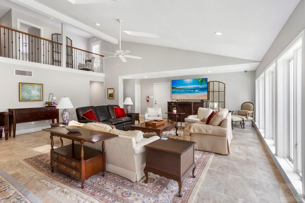 14009 West Hughes Road Dickinson, TX 77539 - Photo 7 of 54 a living room with furniture and a fireplace