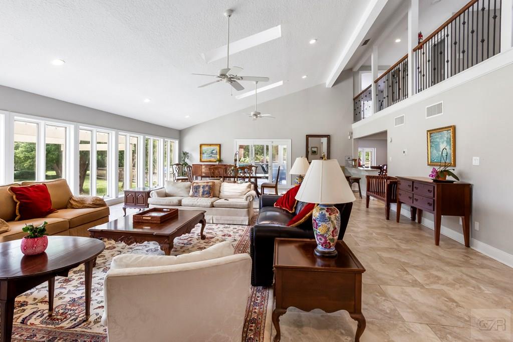 14009 West Hughes Road Dickinson, TX 77539 - Photo 8 of 54 a living room with furniture and a wooden floor