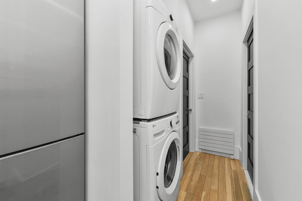 31 Pleasant Street, Unit 1 Boston, MA 02129 - Photo 6 of 8 a utility room with dryer and washer
