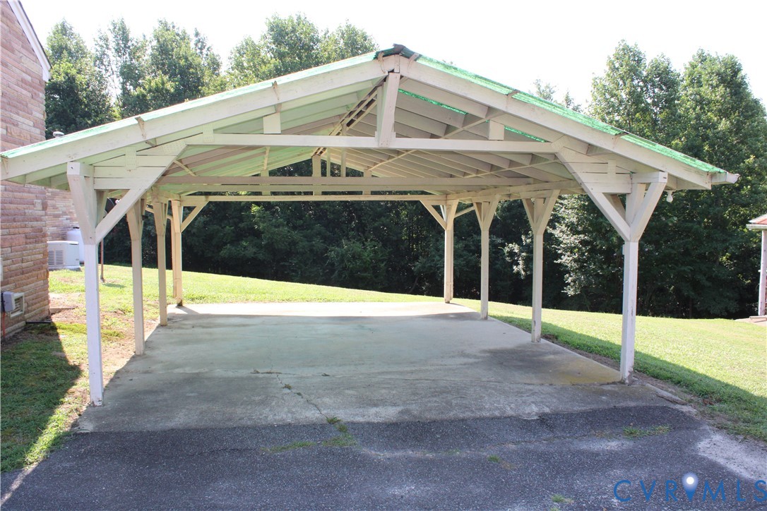 6221 Sturgeon Point Road Providence Forge, VA 23140 - Photo 20 of 26 Open carport structure at rear of home