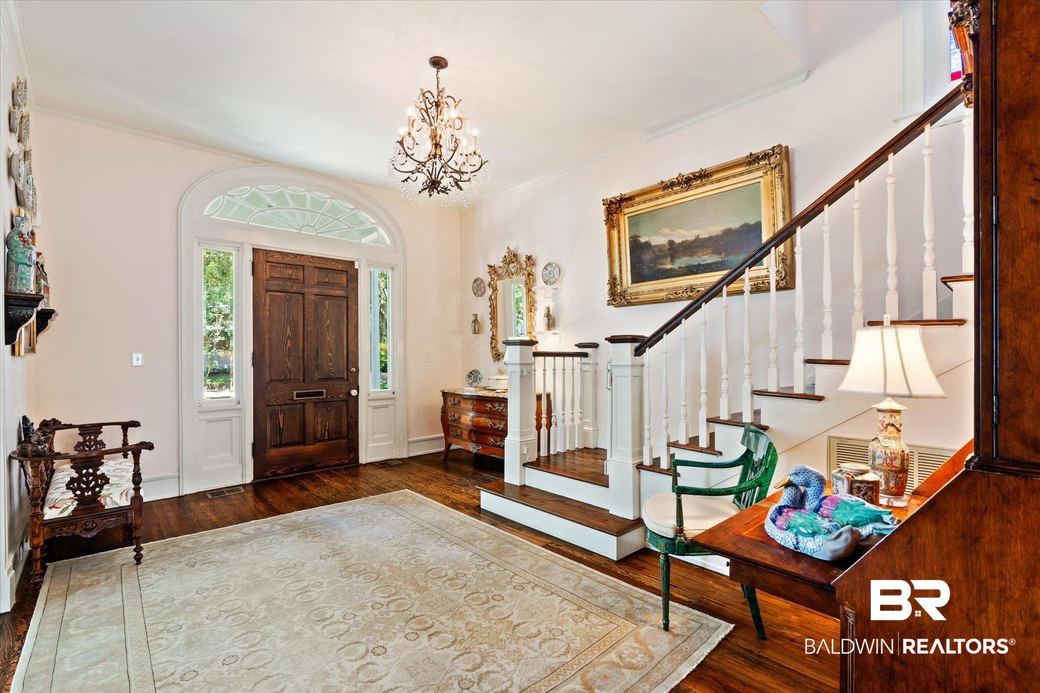 68 North Monterey Street Mobile, AL 36604 - Photo 5 of 30 Entrance foyer featuring hardwood / wood-style floors and a notable chandelier