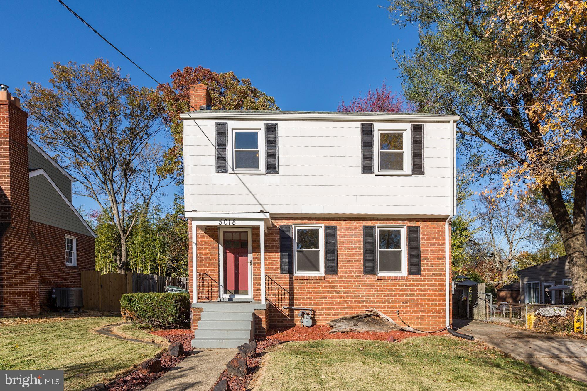 5018 Laguna Road College Park, MD 20740 - Photo 2 of 30 a front view of a house with a yard