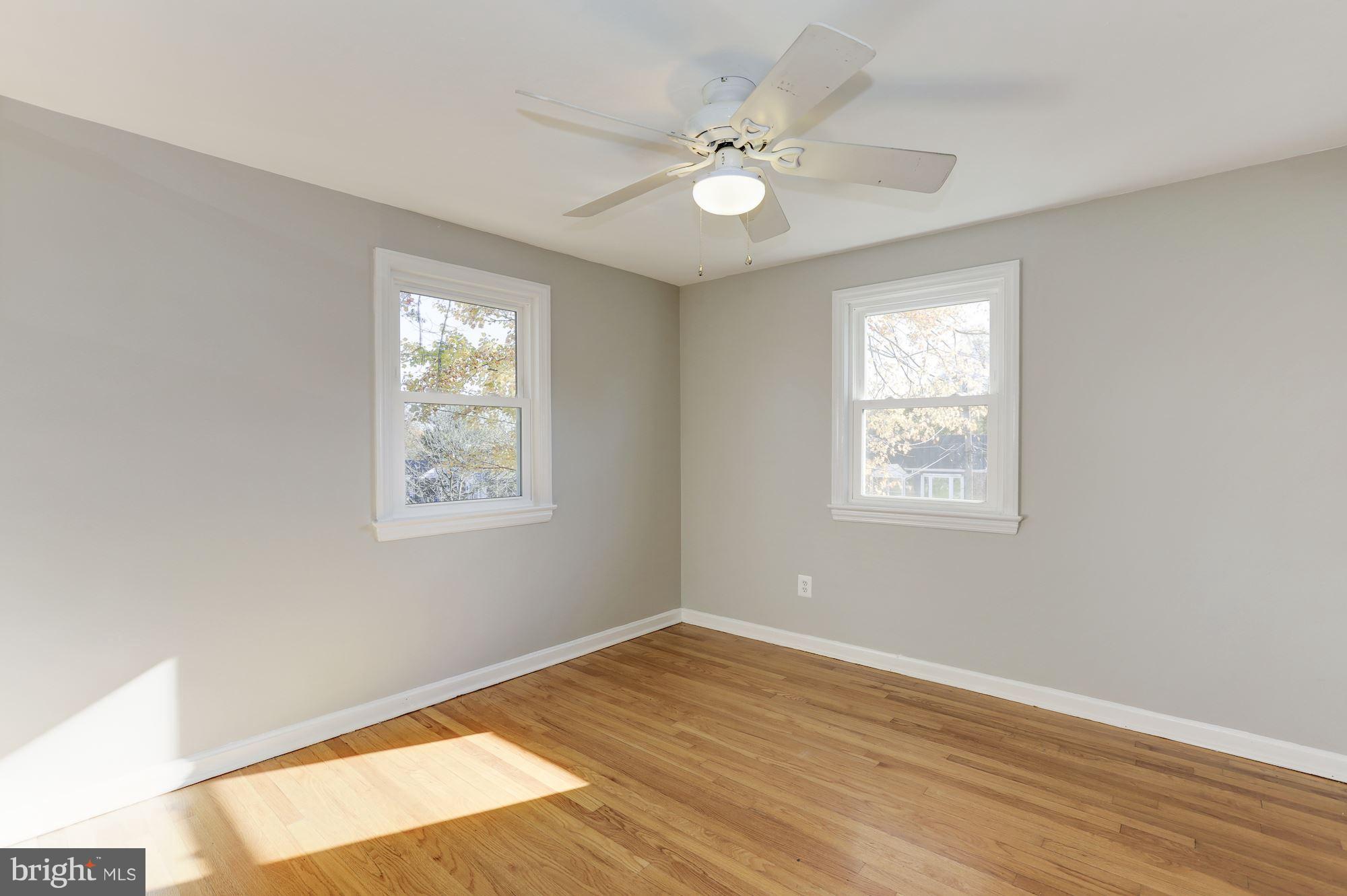 5018 Laguna Road College Park, MD 20740 - Photo 14 of 30 a view of an empty room with wooden floor and a window