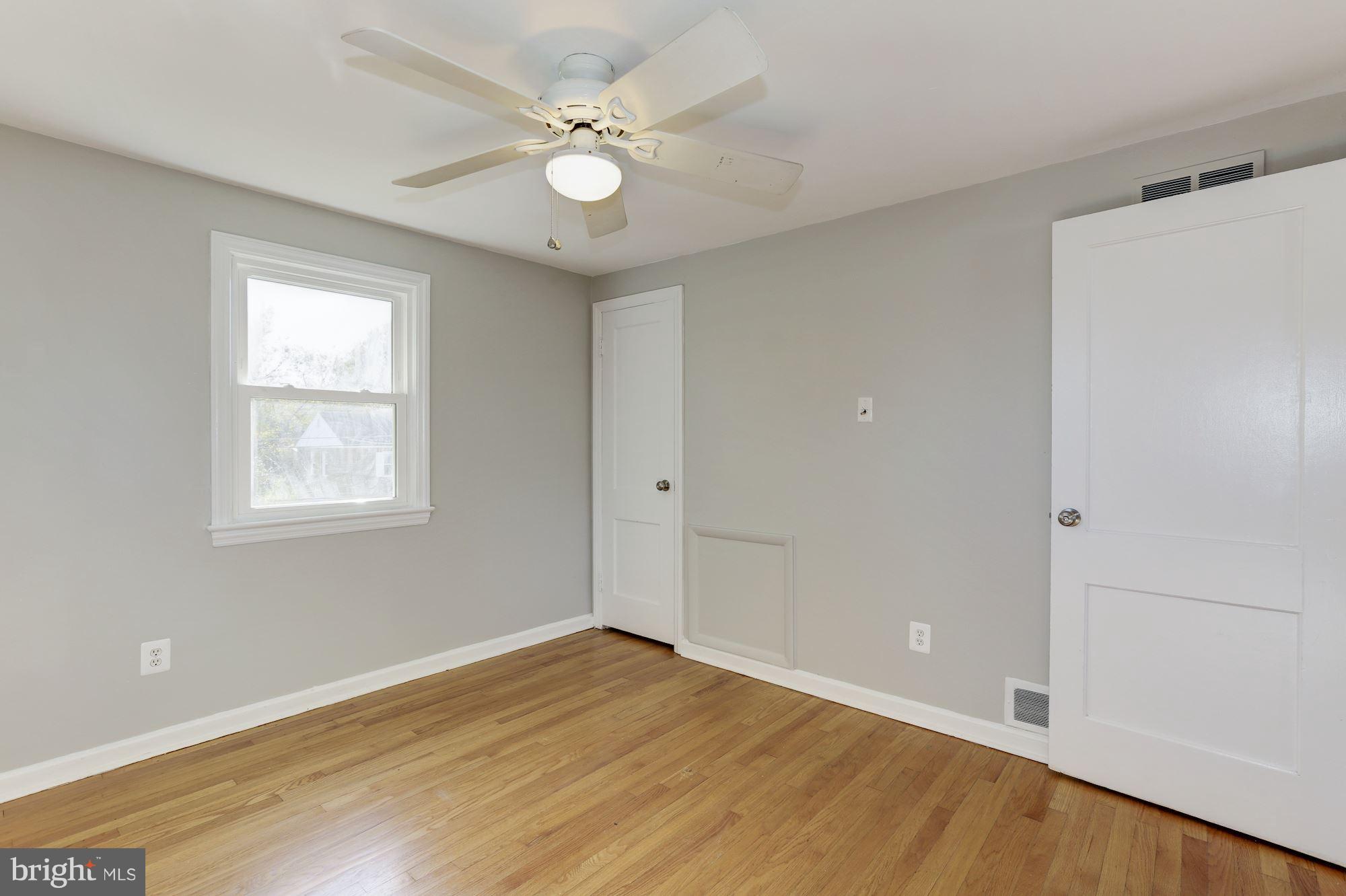 5018 Laguna Road College Park, MD 20740 - Photo 15 of 30 a view of an empty room with wooden floor and a window