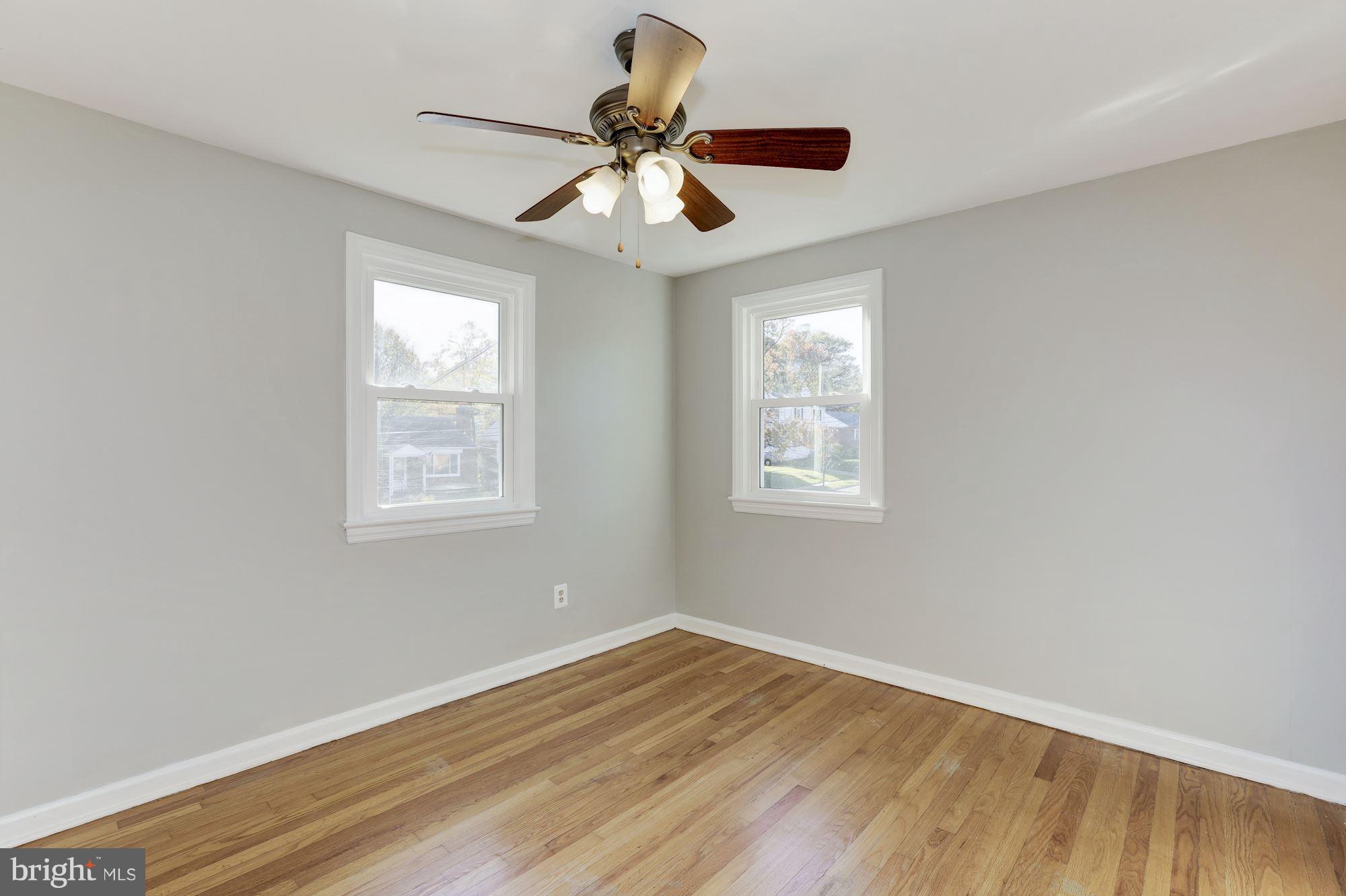 5018 Laguna Road College Park, MD 20740 - Photo 16 of 30 a view of empty room with wooden floor