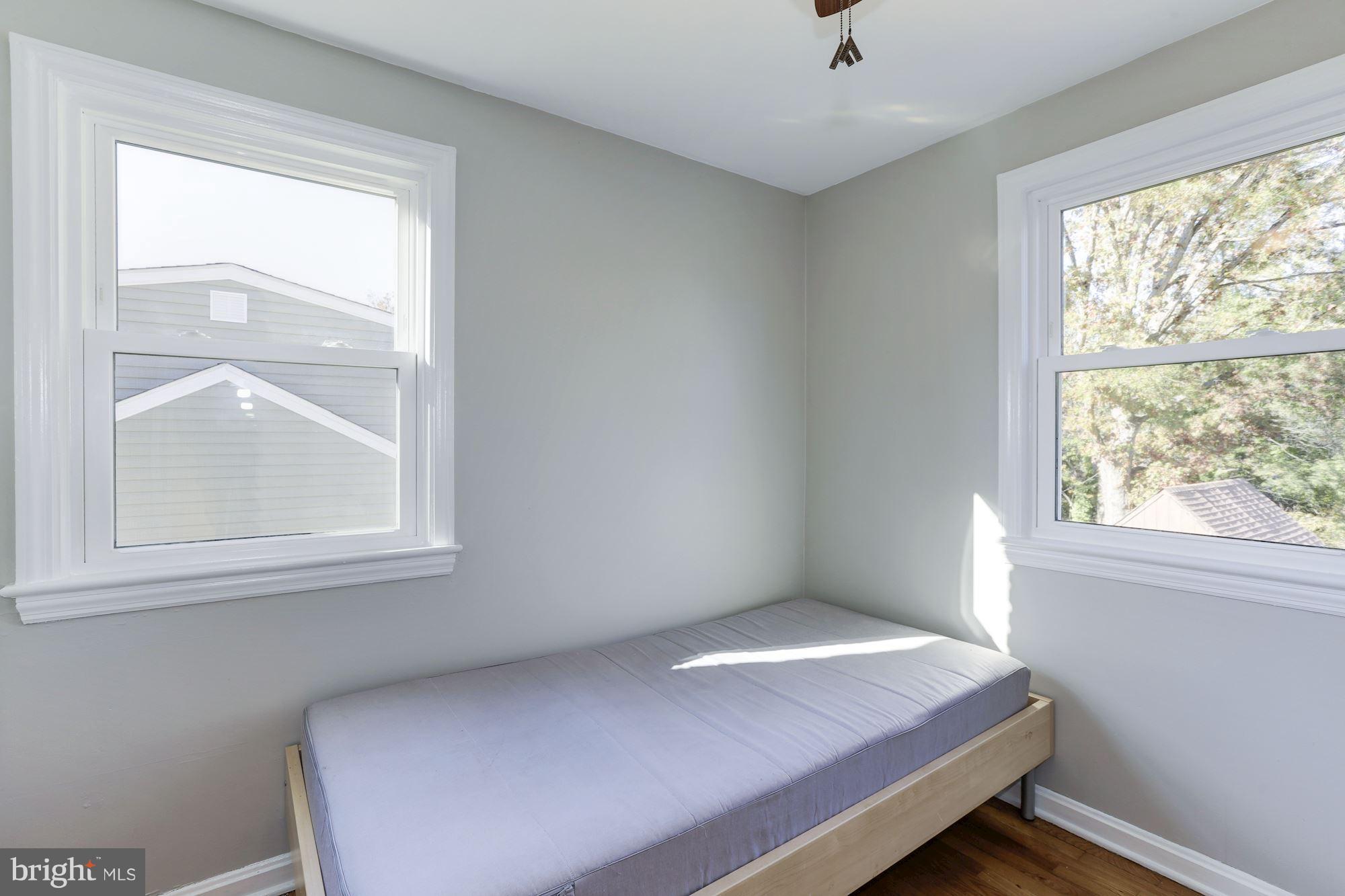 5018 Laguna Road College Park, MD 20740 - Photo 18 of 30 a bedroom with a bed and window