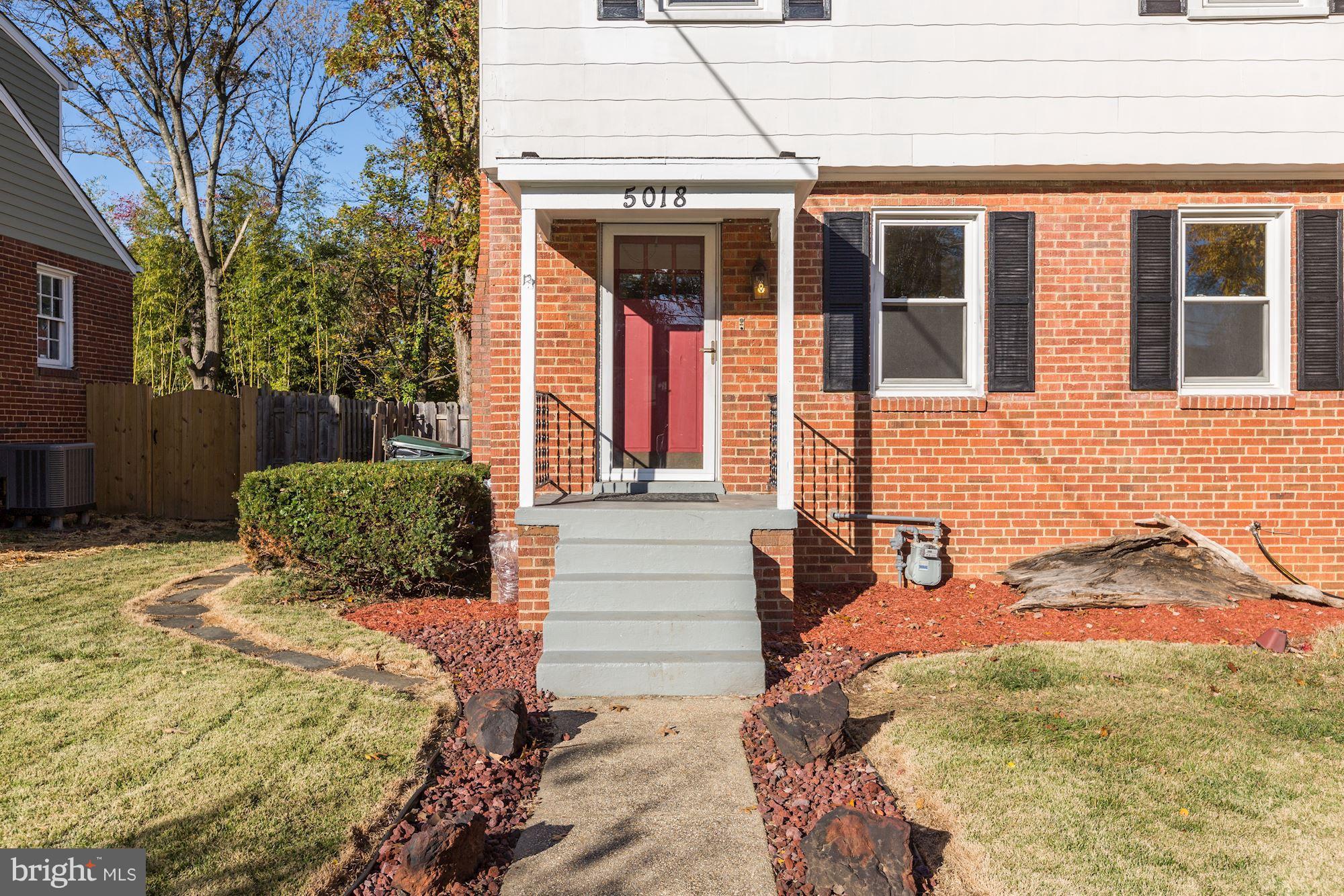 5018 Laguna Road College Park, MD 20740 - Photo 3 of 30 a view of a brick house with many windows