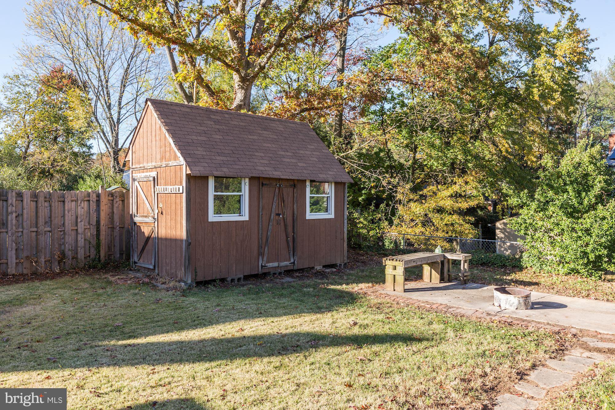 5018 Laguna Road College Park, MD 20740 - Photo 30 of 30 a front view of a house with a garden and tree