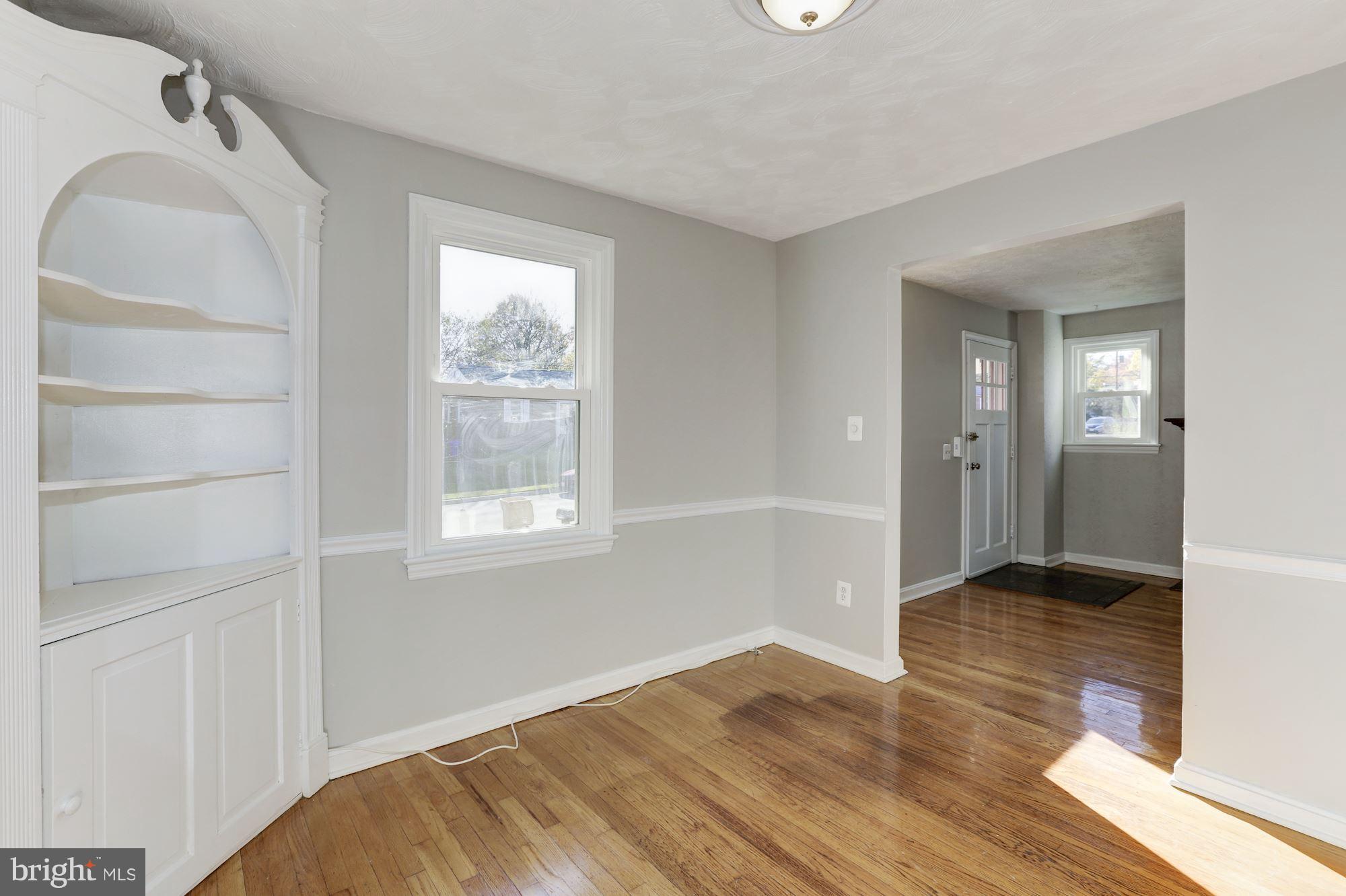 5018 Laguna Road College Park, MD 20740 - Photo 9 of 30 a view of an empty room with wooden floor and a window