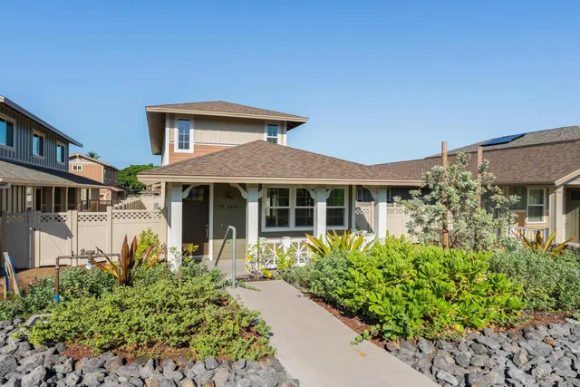 front view of a house with a garden