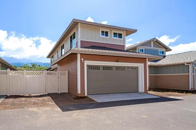 a front view of a house with a garage
